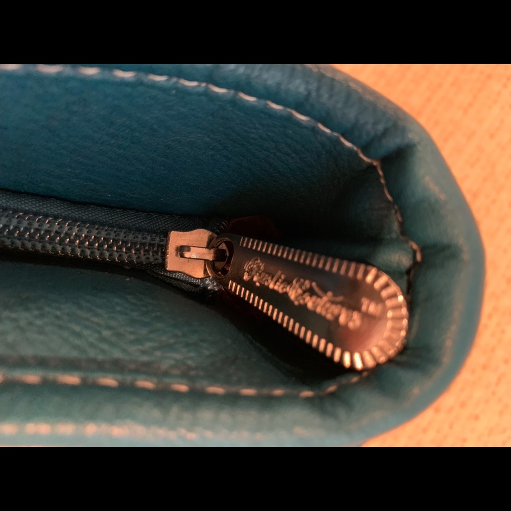 Woman’s leather teal purse